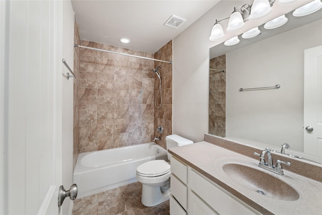 full bathroom with tile patterned flooring, vanity, toilet, and tiled shower / bath combo