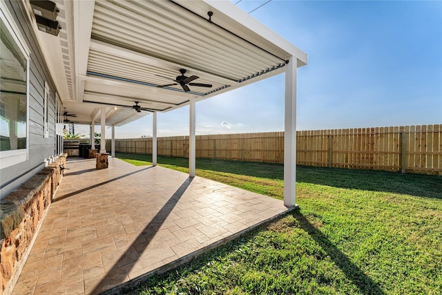 view of patio / terrace featuring ceiling fan