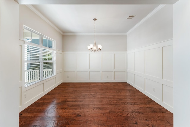 unfurnished dining area with dark hardwood / wood-style floors, an inviting chandelier, and ornamental molding