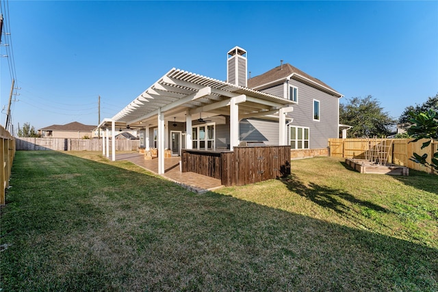 back of house with a lawn, a patio area, and a pergola