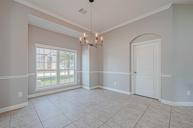 spare room with light tile patterned floors, ornamental molding, and a notable chandelier