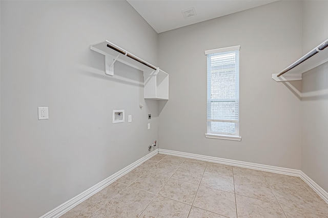 washroom with hookup for an electric dryer, hookup for a washing machine, hookup for a gas dryer, and light tile patterned flooring