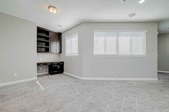 interior space featuring light colored carpet