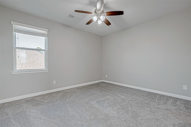 carpeted empty room featuring ceiling fan