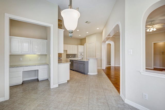 kitchen featuring pendant lighting, gray cabinetry, white cabinets, sink, and stainless steel dishwasher