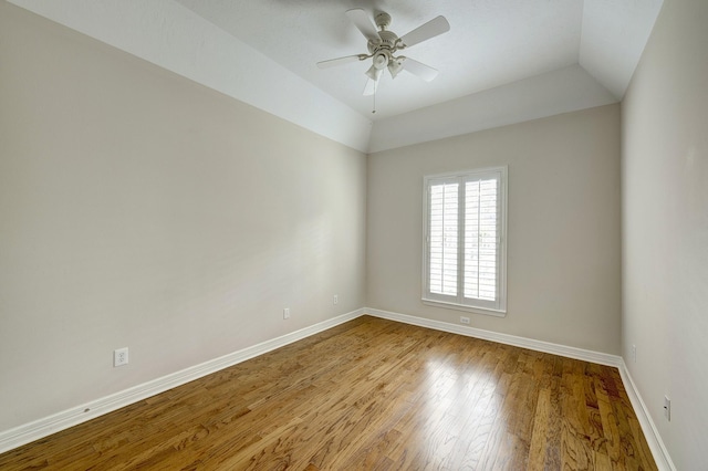 unfurnished room featuring hardwood / wood-style flooring, ceiling fan, and lofted ceiling