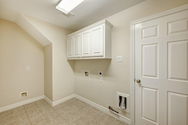 laundry area with cabinets, hookup for an electric dryer, gas dryer hookup, hookup for a washing machine, and light tile patterned floors