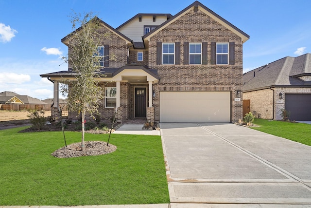 view of front of home featuring a garage and a front yard