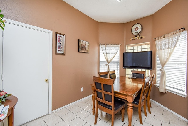 dining room featuring light tile patterned flooring