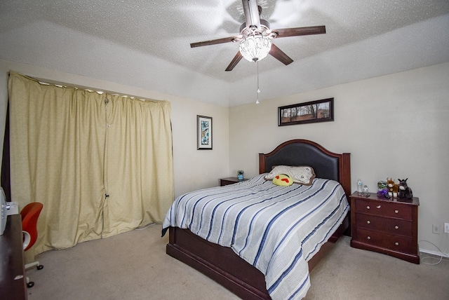 bedroom featuring ceiling fan, a textured ceiling, light carpet, and vaulted ceiling