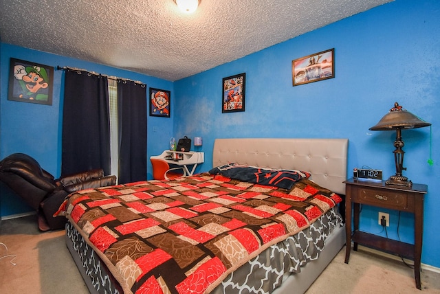 bedroom with carpet floors and a textured ceiling