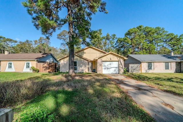 single story home with a front lawn and a garage