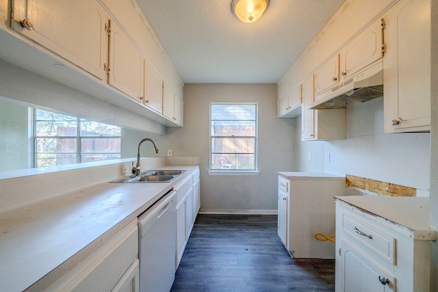 kitchen featuring white cabinets, white dishwasher, dark hardwood / wood-style floors, and sink