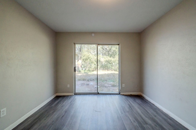 empty room featuring dark hardwood / wood-style floors