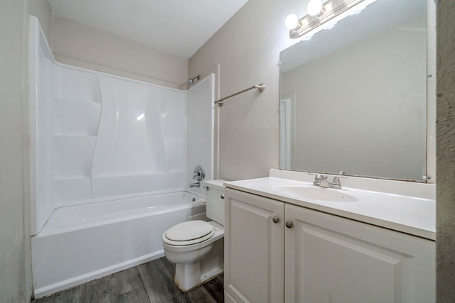 full bathroom featuring hardwood / wood-style floors, vanity, shower / bath combination, and toilet