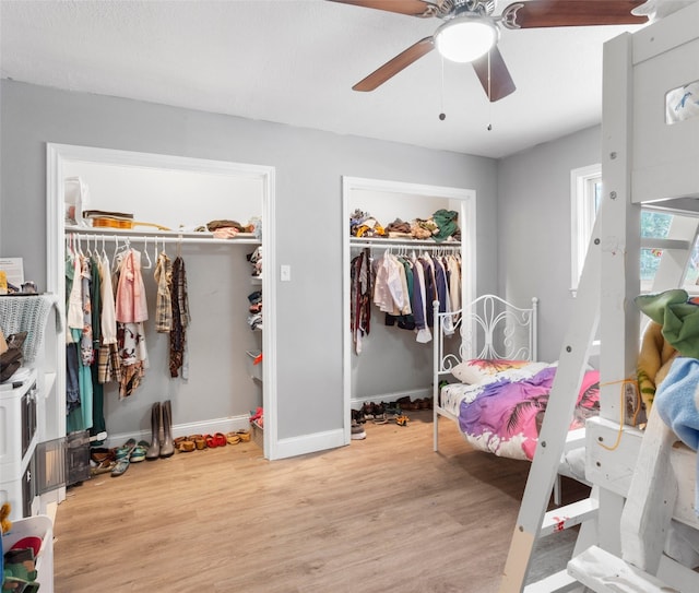 bedroom with ceiling fan and light hardwood / wood-style floors