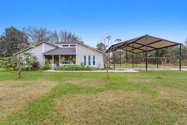 exterior space with a yard, covered porch, and a carport