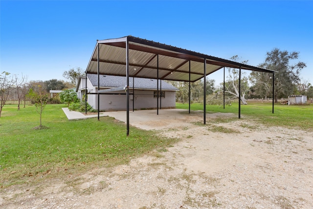 view of parking featuring a carport and a lawn