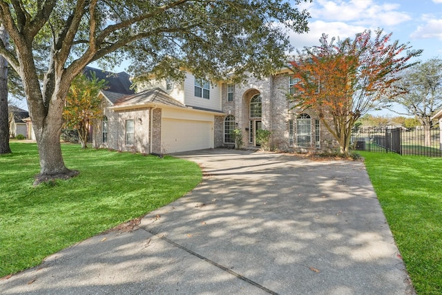 view of front of property with a front yard and a garage