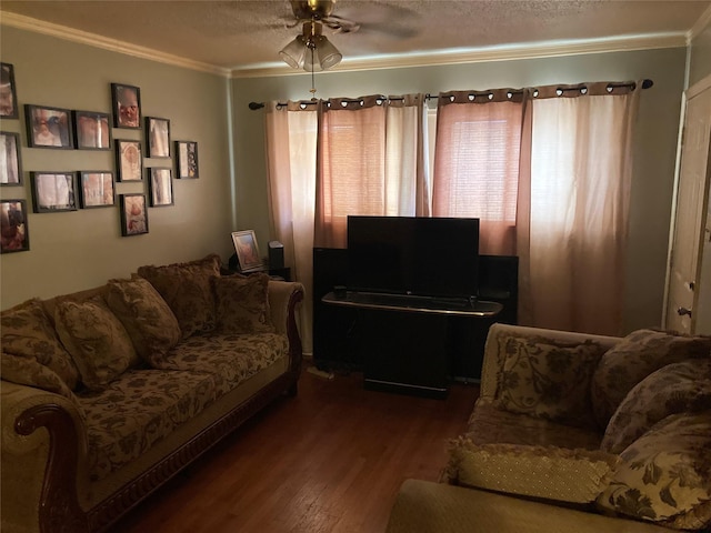 living room with hardwood / wood-style floors, ceiling fan, crown molding, and a textured ceiling