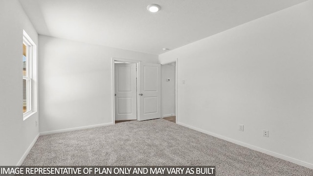 unfurnished bedroom featuring carpet flooring