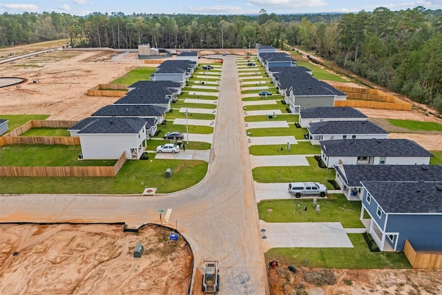 11983 Midas Ln, Willis, TX 77378 - aerial perspective of suburban area featuring a forest