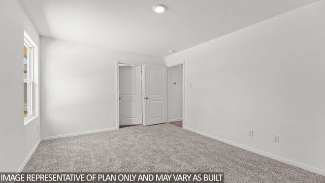 unfurnished bedroom featuring carpet