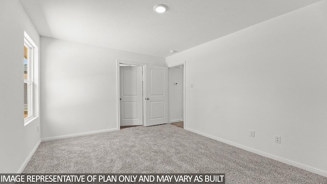 11983 Midas Ln, Willis, TX 77378 - unfurnished room featuring carpet flooring and plenty of natural light