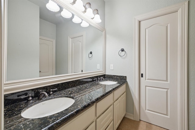 bathroom with tile patterned floors and vanity