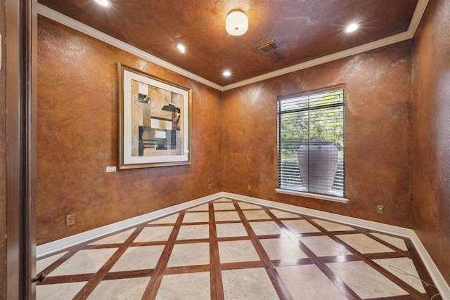 empty room featuring ornamental molding