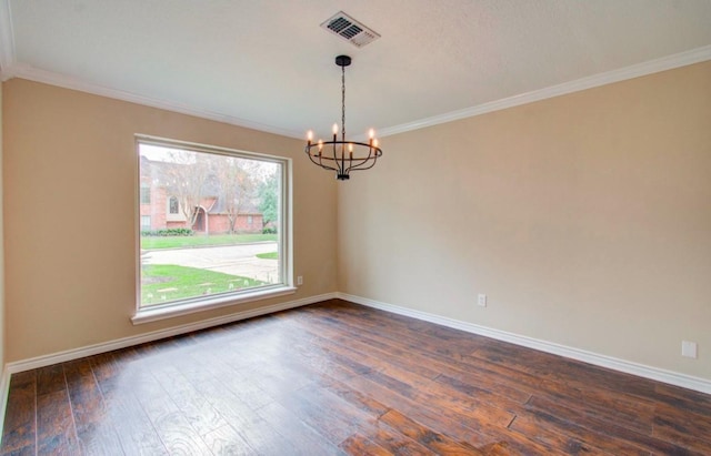 unfurnished room with dark hardwood / wood-style flooring, ornamental molding, and an inviting chandelier