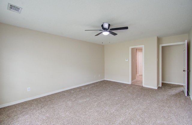 unfurnished bedroom featuring light colored carpet and ceiling fan