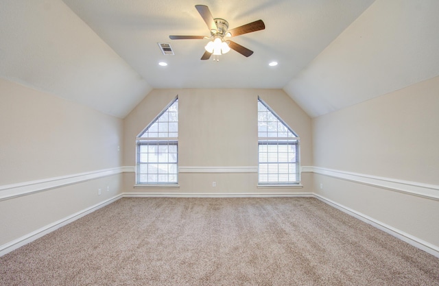 bonus room featuring plenty of natural light, carpet, and lofted ceiling