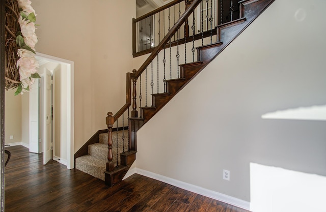 staircase with wood-type flooring