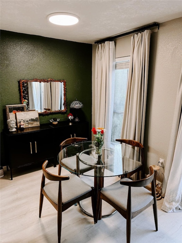 dining area featuring hardwood / wood-style flooring