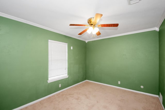 carpeted empty room with crown molding and ceiling fan