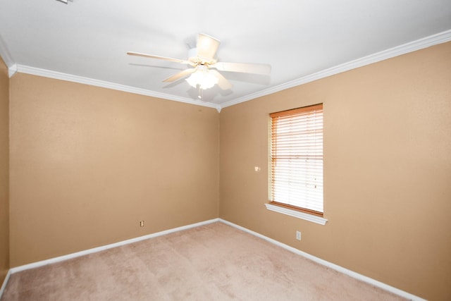 unfurnished room with ceiling fan, light colored carpet, and crown molding