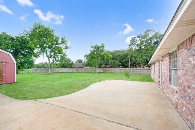 view of patio with a storage unit