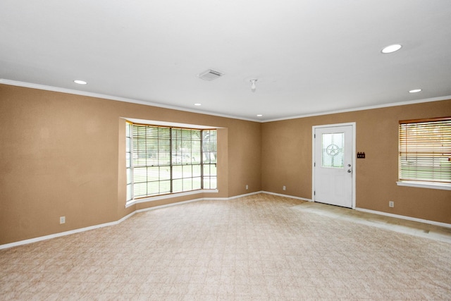 interior space featuring light colored carpet and ornamental molding