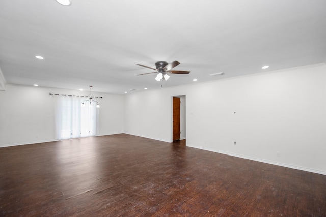 unfurnished room with ceiling fan and dark hardwood / wood-style floors