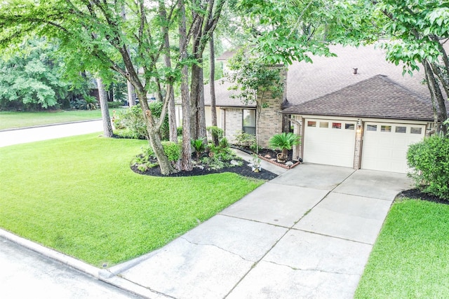 view of front of house featuring a front lawn and a garage