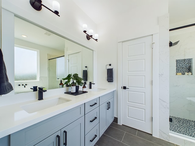 8321 Springwood Creek Ln, Houston, TX 77055 - bathroom with a marble finish shower, double vanity, and tile patterned floors