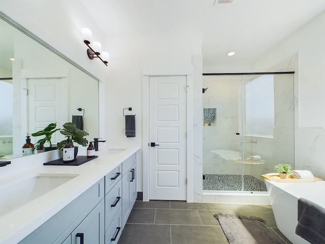 8321 Springwood Creek Ln, Houston, TX 77055 - full bathroom featuring a marble finish shower, tile patterned floors, a soaking tub, and double vanity