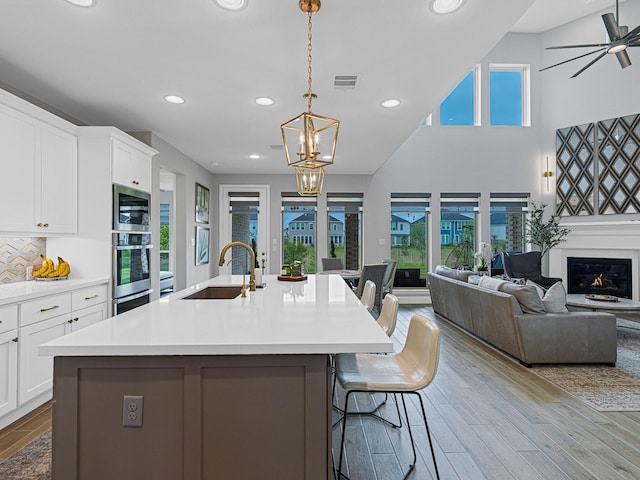 kitchen with a wealth of natural light, sink, a breakfast bar area, and stainless steel appliances