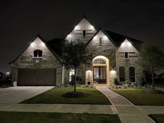 french country style house featuring a yard and french doors