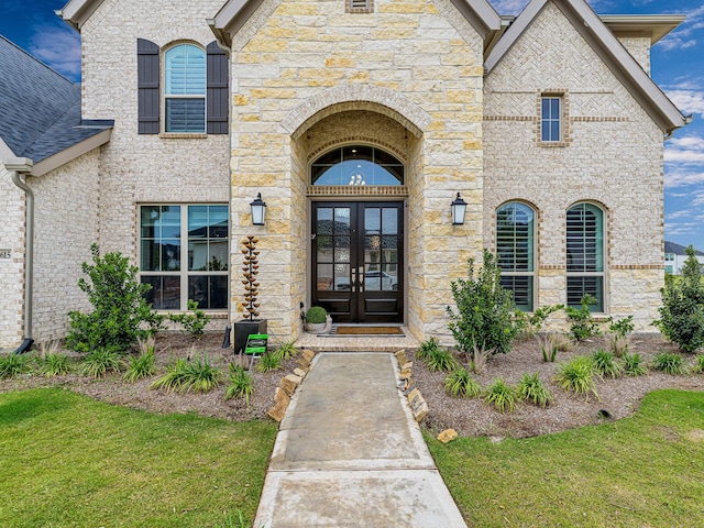 property entrance featuring french doors