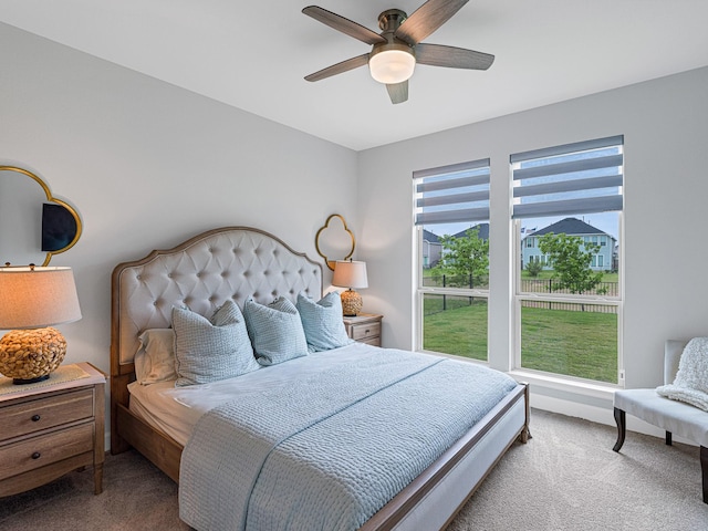 carpeted bedroom with ceiling fan