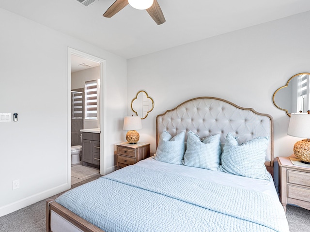 carpeted bedroom featuring connected bathroom and ceiling fan