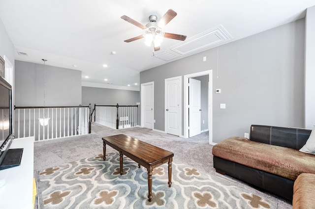 carpeted living room featuring ceiling fan