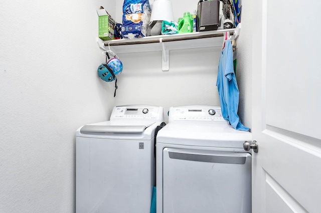 laundry room with separate washer and dryer